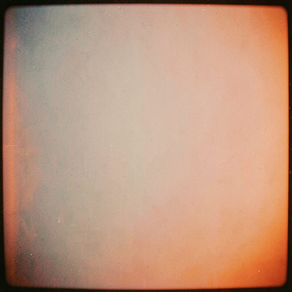 A faded grainy photograph with a nostalgic, documentary quality in muted earth tones